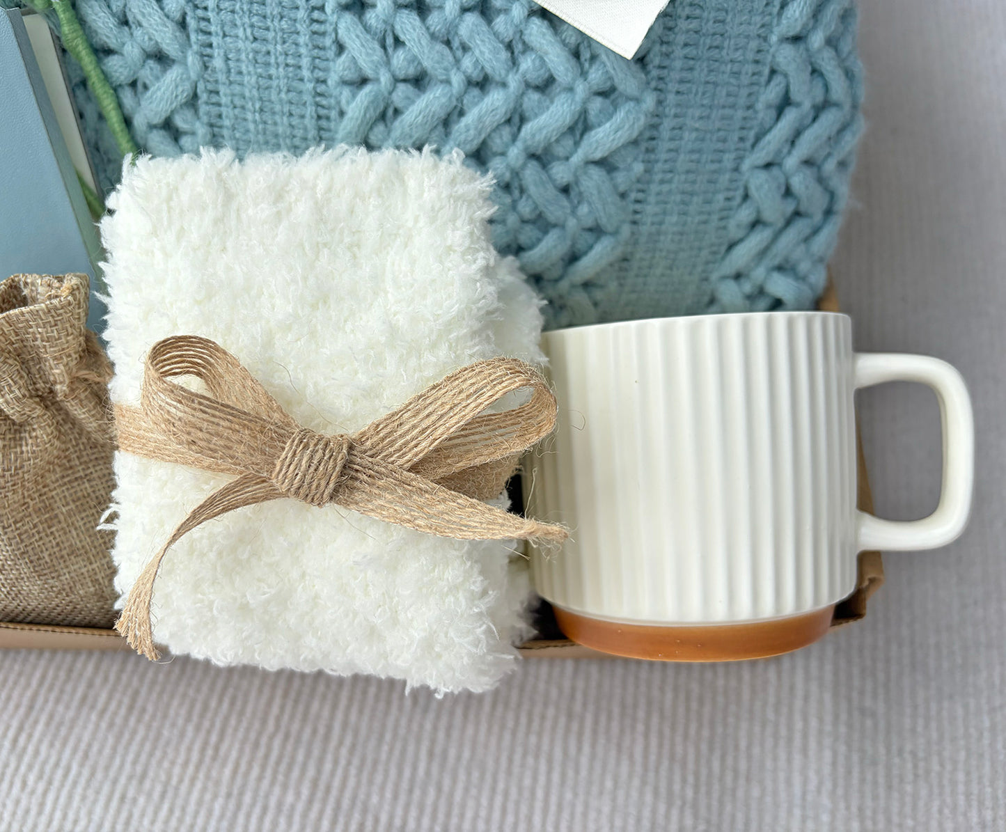 Soft Sky Blue Cozy Gift Box | Cable Knit Blanket, Ceramic Mug, Notebook, Fuzzy Socks, Scent Bag & Crochet Tulip Gift Basket komorebi INC