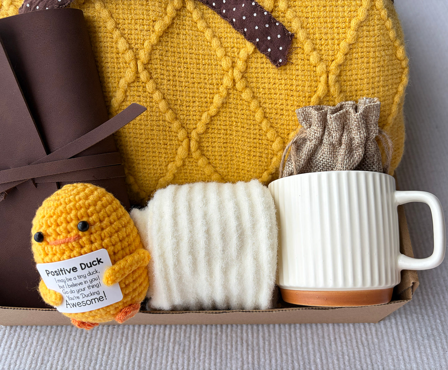 Sunny Yellow Self-Care Gift Basket for Her | Cozy Blanket, Positive Knit Duck, Leather Journal, Mug, Socks & Scented Sachet komorebi INC