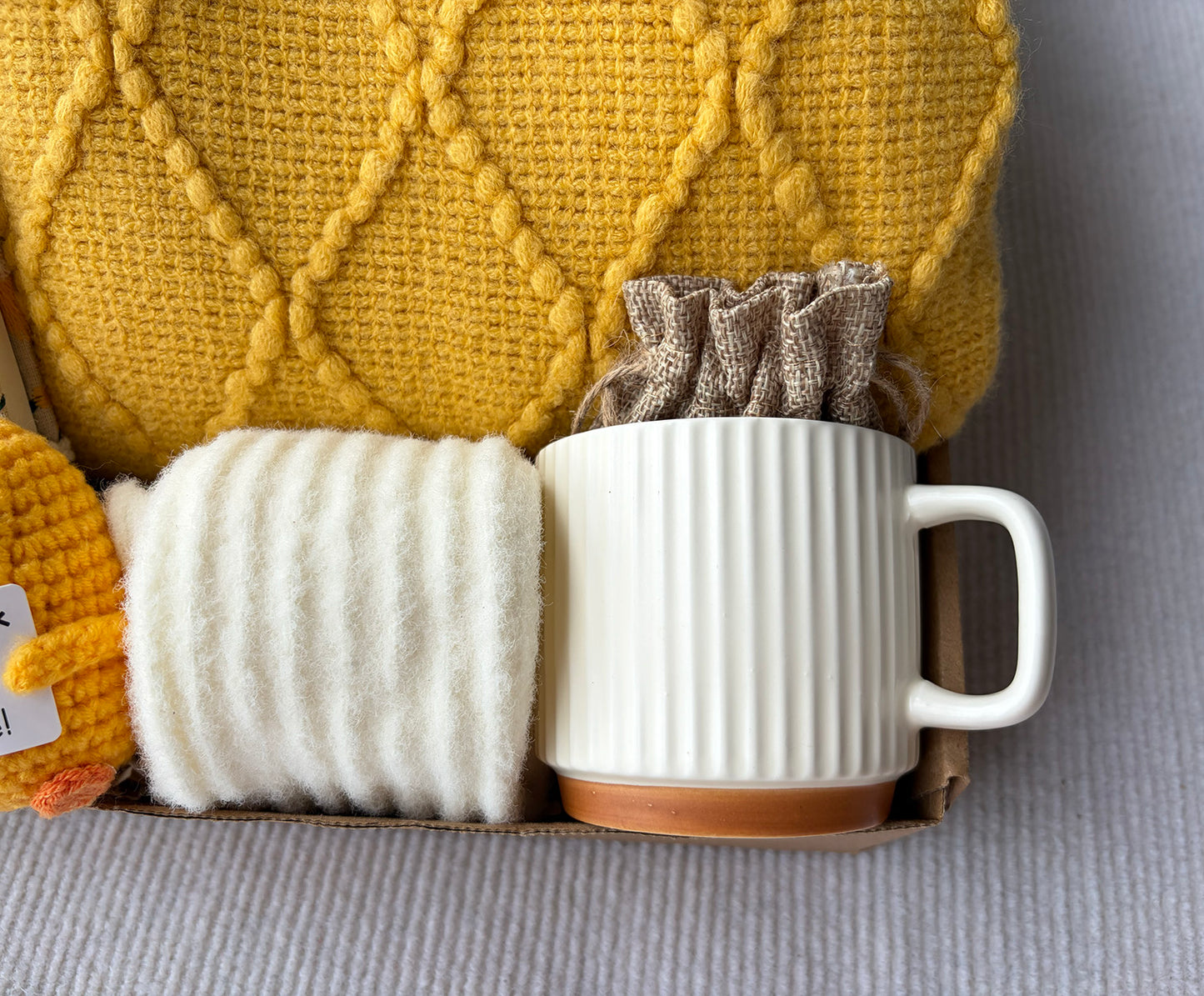 Sunny Yellow Self-Care Gift Basket for Her | Cozy Knit Blanket, Ceramic Mug, Daisy Journal, Scented Sachet & Positive Duck Decor komorebi INC