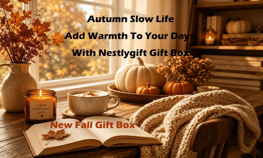 Cozy fall slow‑living scene with pumpkins, knit blanket, coffee cup and candle, Nestlygift autumn gift box blog header