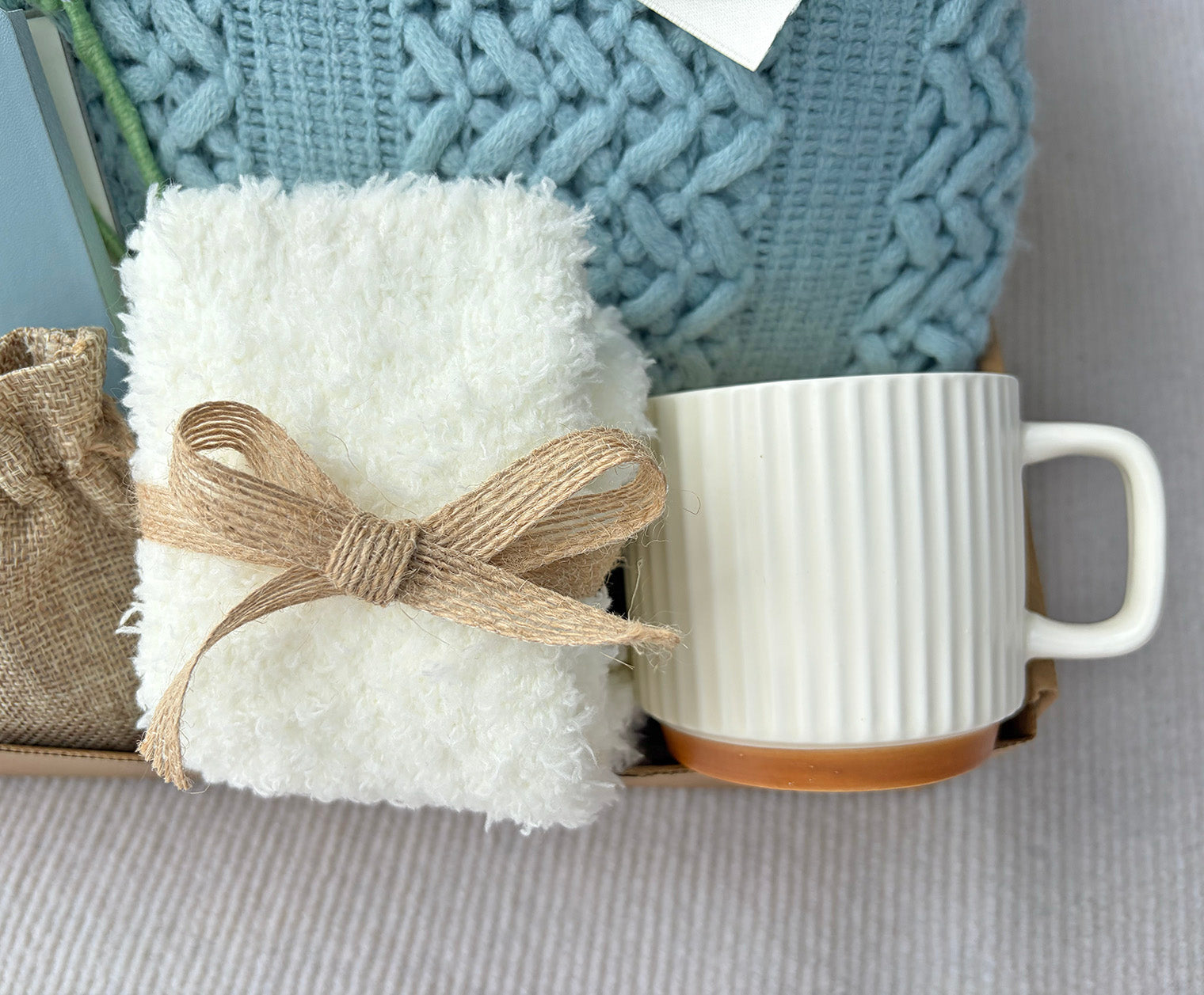 Soft Sky Blue Cozy Gift Box | Cable Knit Blanket, Ceramic Mug, Notebook, Fuzzy Socks, Scent Bag & Crochet Tulip Gift Basket komorebi INC