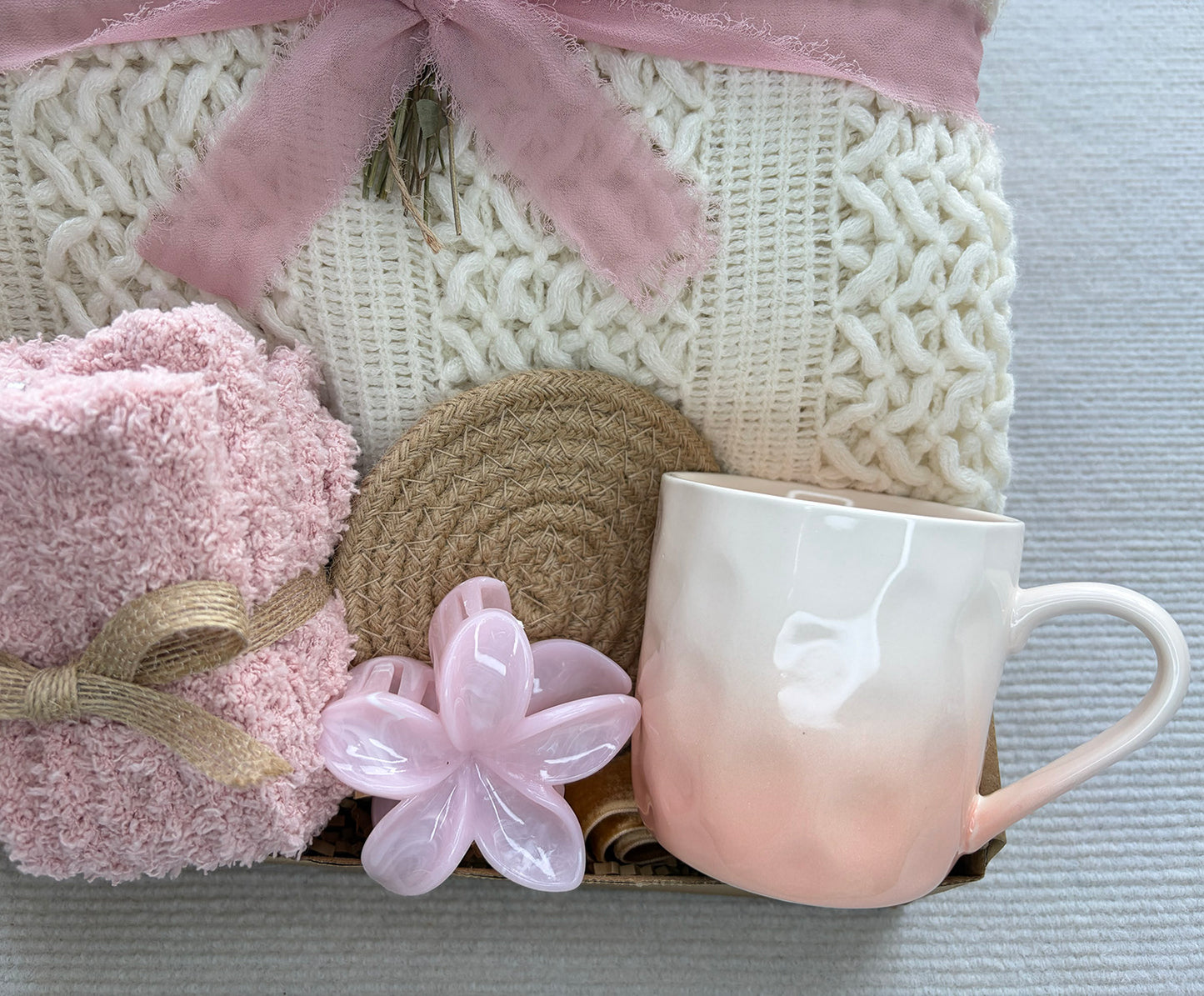 Pastel Self Care Gift Basket | Cable Knit Blanket, Pink Gradient Mug, Bath Puff & Dried Flower Gift for Her komorebi INC