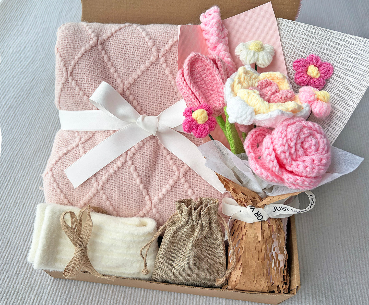 Pink Geometric Knit Blanket Gift Basket with Handmade Crochet Flowers | Cozy Self Care Present komorebi INC