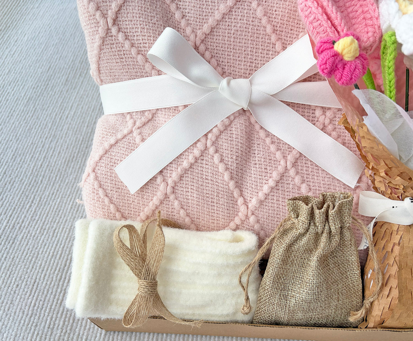 Pink Geometric Knit Blanket Gift Basket with Handmade Crochet Flowers | Cozy Self Care Present komorebi INC
