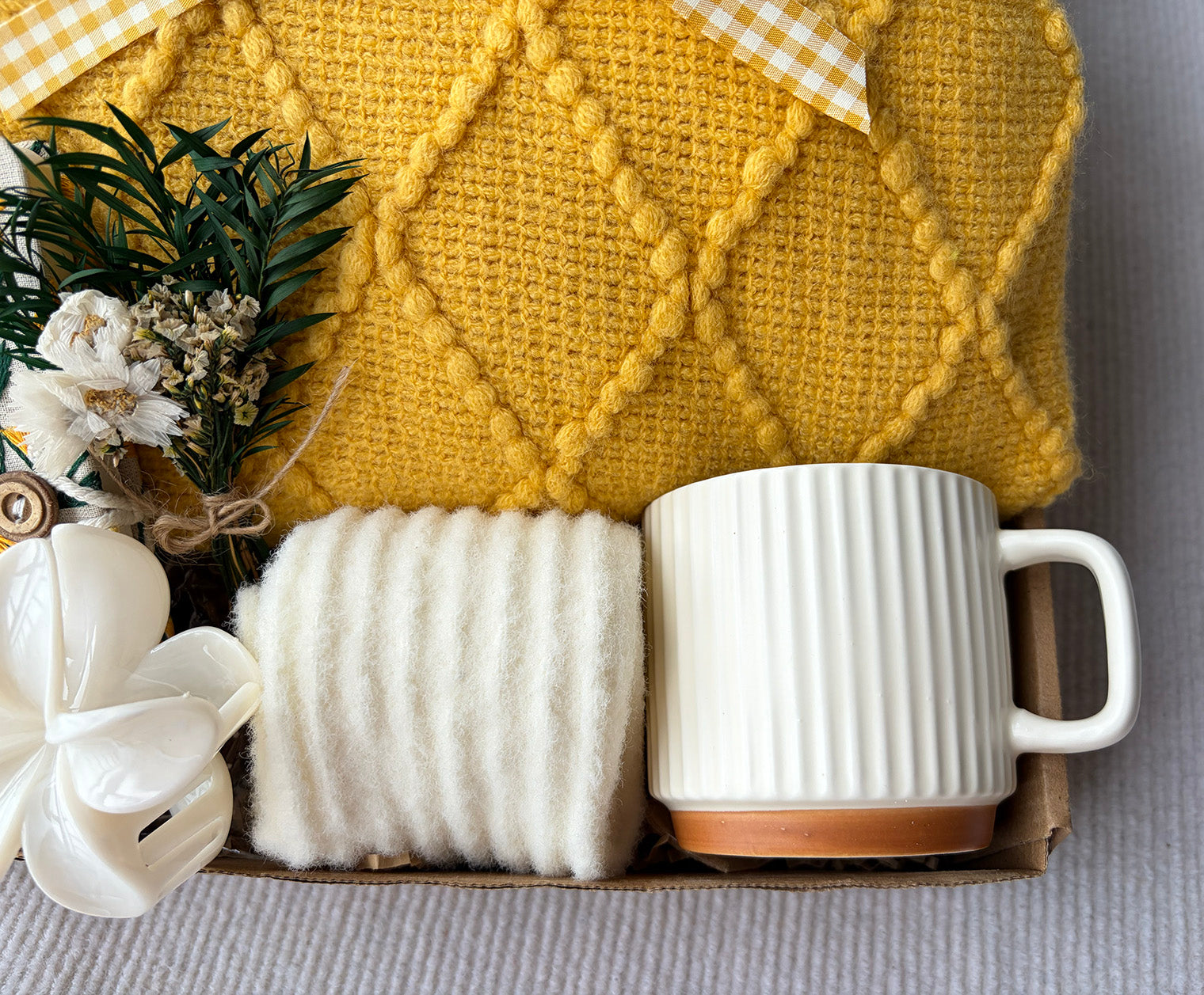 Sunny Yellow Self-Care Gift Basket for Her | Cozy Knit Blanket, Ceramic Mug, Fuzzy Socks, Daisy Notebook & Dried Flower Decor komorebi INC