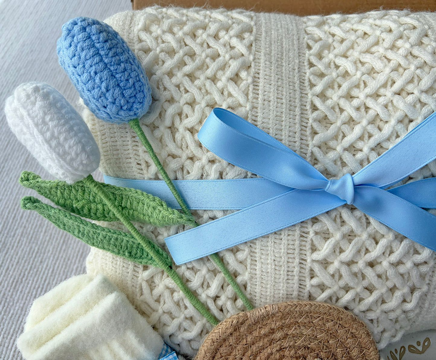 Cream Sky Blue Cozy Gift Basket for Her – Self Care Gift Box with Knit Blanket, Botanical Mug, Fuzzy Socks, Scented Sachet & Crochet Tulips komorebi INC