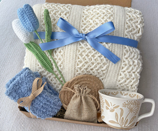 Cream Sky Blue Cozy Gift Basket for Her – Self Care Gift Box with Knit Blanket, Botanical Mug, Fuzzy Socks, Scented Sachet & Crochet Tulips komorebi INC