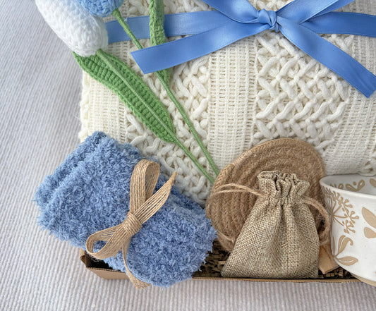 Cream Sky Blue Cozy Gift Basket for Her – Self Care Gift Box with Knit Blanket, Botanical Mug, Fuzzy Socks, Scented Sachet & Crochet Tulips komorebi INC
