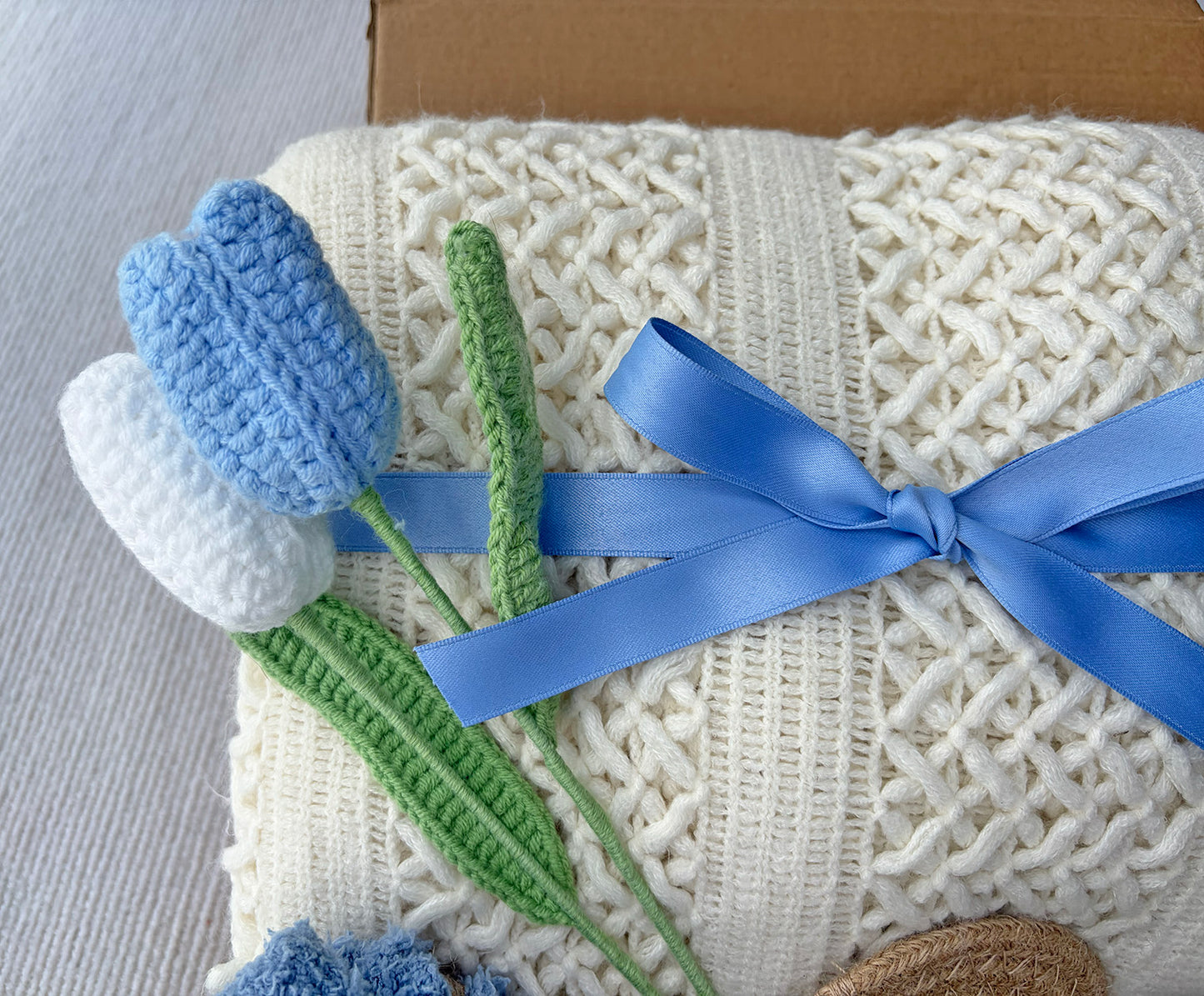 Cream Sky Blue Cozy Gift Basket for Her – Self Care Gift Box with Knit Blanket, Botanical Mug, Fuzzy Socks, Scented Sachet & Crochet Tulips komorebi INC