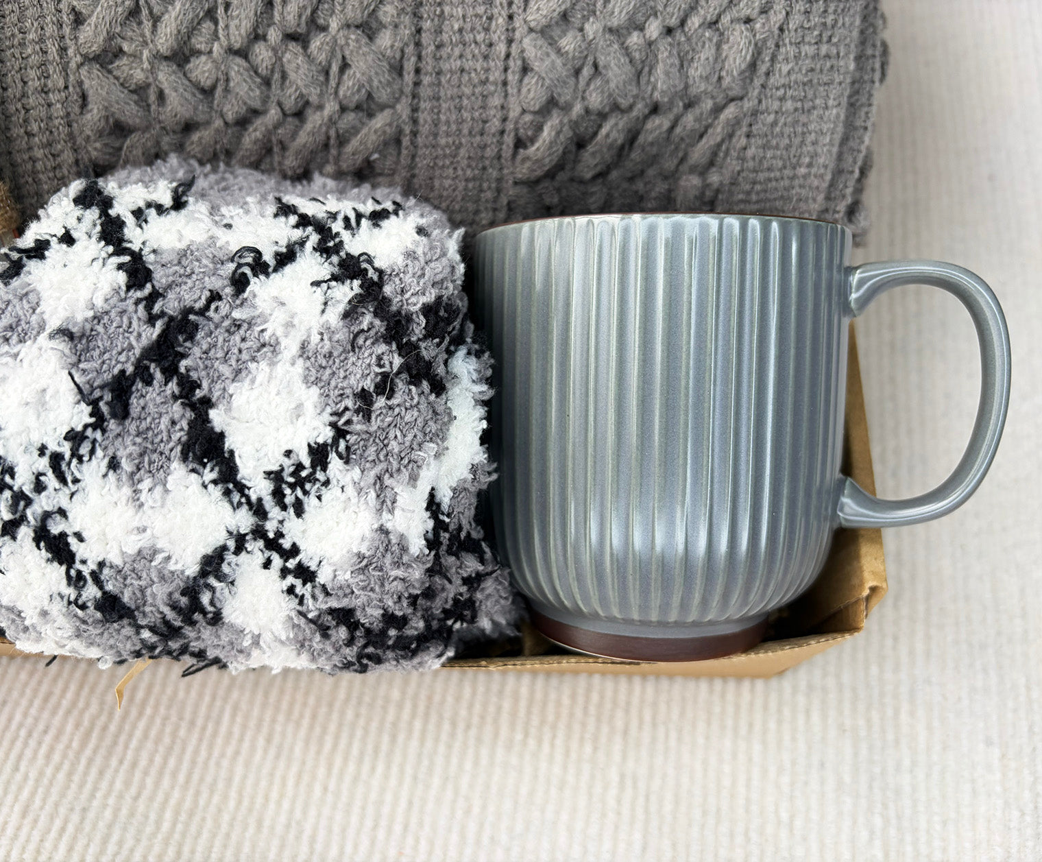 Grey Self-Care Gift Basket for Him & Her | Cable Knit Blanket, Ceramic Mug, Plaid Fuzzy Socks, Leather Journal & Motivational Potato Doll komorebi INC