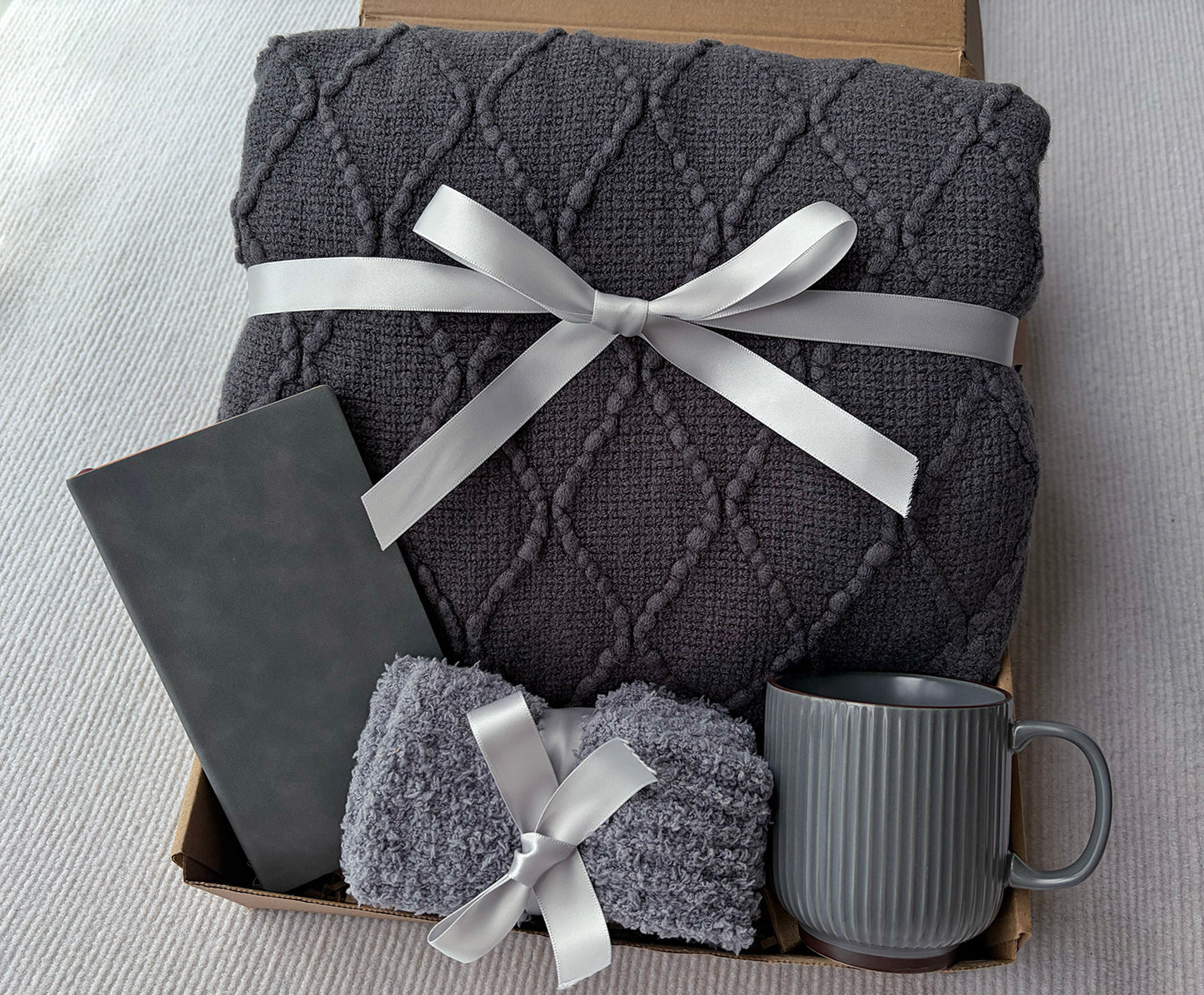Charcoal Grey Self-Care Gift Basket for Him & Her | Knit Blanket, Ceramic Mug, Fuzzy Socks & Leather Journal Set komorebi INC