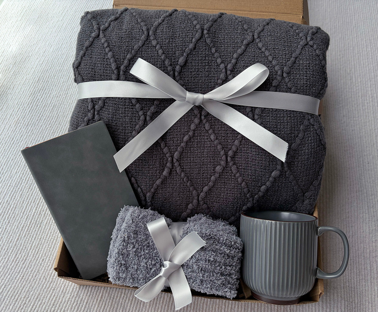 Charcoal Grey Self-Care Gift Basket for Him & Her | Knit Blanket, Ceramic Mug, Fuzzy Socks & Leather Journal Set komorebi INC